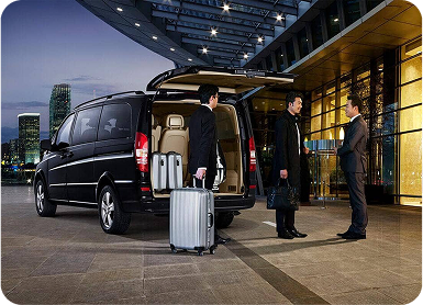 a group of men standing next to a van